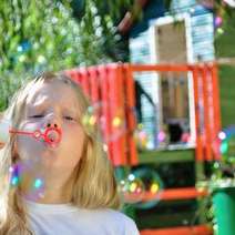  A girl with a bubble-blower