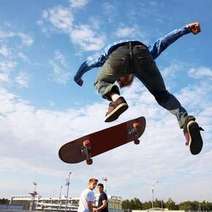  A guy jumping on a skateboard