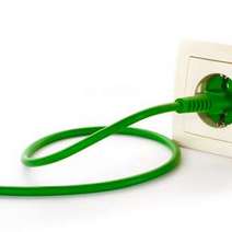  A green cable plugged in a socket