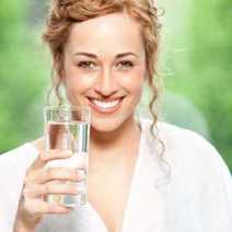 A girl with a glass of water.