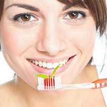  A woman brushing her teeth
