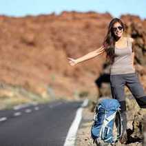 A lady hitchhiking