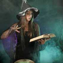 A witch reading from a book