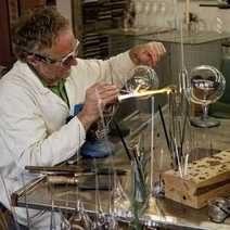 A man in a lab pouring something