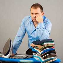 A guy ironing clothes