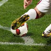 A football player taking a corner kick