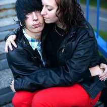 Young couple sitting on a staircase