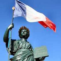 A statue holding the French flag