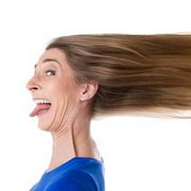  A woman doing funny face with her hair blown back