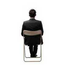 A guy sitting on a chair