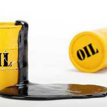An oil barrel with oil spilling from it