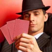 A man looking at his cards