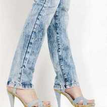 A woman in high heels wearing jeans