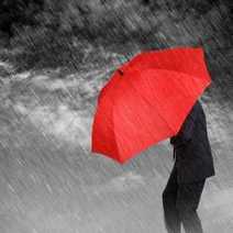  A man under red umbrella in rain
