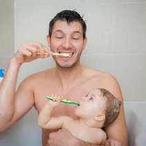  Dad and his kid brushing their teeth