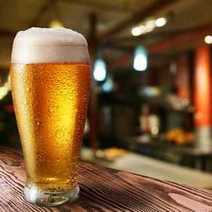  A big glass of bier set on a table