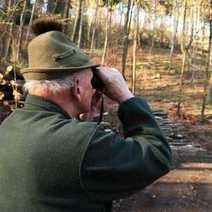  A forester watching through binoculars