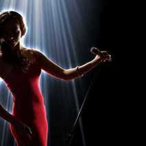  Female star in red robe singing on a concert