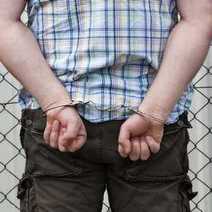A handcuffed guy