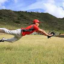  Baseball player catching a ball on a field