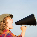  A girl shouting in an amplifier