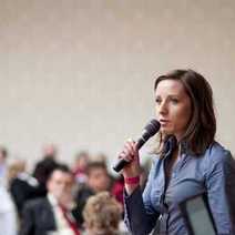 a woman talking to an audience