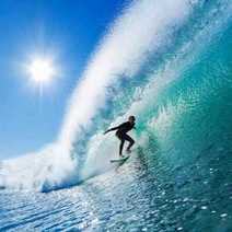 a surfer riding a breaking wave