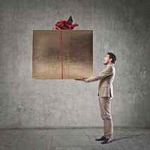 a man holding a big present box