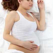 Sleeping pregnant women in white shirt