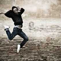 A boy on a stylish dance jump